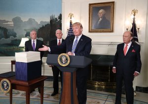 Donald Trump speaks to the press about the $1.3 trillion spending bill passed by Congress on March 23, 2018. (Credit: Mark Wilson/Getty Images)