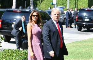 US President Donald Trump and First Lady Melania Trump arrive for Easter service at the Church of Bethesda-by-the-Sea in Palm Beach, Florida, April 1, 2018. (Credit: NICHOLAS KAMM/AFP/Getty Images)