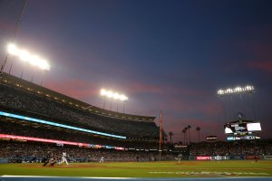 Yasiel Puig #66 of the Los Angeles Dodgers hits an RBI double in the sixth inning during the MLB game against the San Francisco Giants at Dodger Stadium on April 1, 2018. (Credit: Victor Decolongon/Getty Images)
