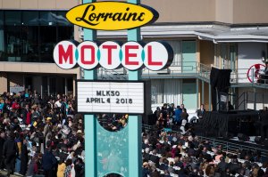 People listen to speakers during an event at the Lorraine Motel commemorating  the 50th anniversary of the assassination of Martin Luther King Jr. April 4, 2018, in Memphis, Tennessee.(Credit: Brendan Smialowski / AFP / Getty Images)