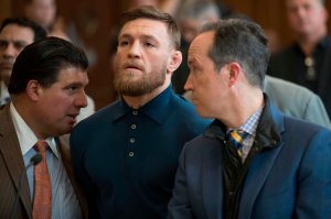 Irish Mixed Martial Arts fighter Conor McGregor looks on next to his lawyers Jim Walden,right, and John Arlia, left, during his arraignment at the Kings County Criminal Court in Brooklyn on April 6, 2018. (Credit: Mary Altaffer / AFP / Getty Images)