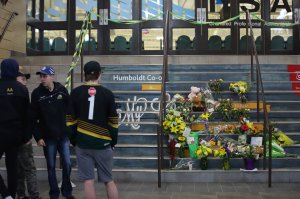 Flowers are left outside the Humboldt Uniplex ice-skating rink on April 7, 2018 in Humboldt, Saskatchewan after a bus carrying a junior ice hockey team collided with a semi-trailer truck near Tisdale and Nipawin, Saskatchewan province. (Credit: KYMBER RAE/AFP/Getty Images)