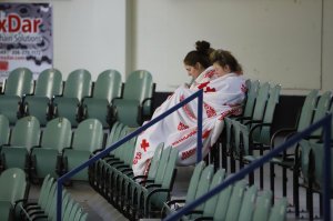 Two girls sit amid empty seats of the Humboldt Uniplex ice-skating rink on April 7, 2018, in Humboldt, Canada, after a bus carrying a junior ice hockey team collided with a semi-trailer truck near Tisdale and Nipawin. (Credit: Kymber Rae / AFP / Getty Images)