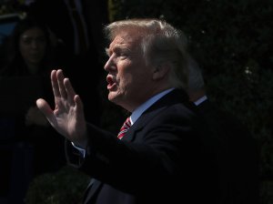 Donald Trump waves to the crowd after an event to honor the 2017 NCAA Football National Champion Alabama Crimson Tide, at the White House on April 10, 2018. (Credit: Mark Wilson/Getty Images)