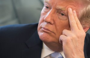 President Donald Trump listens to victims stories before signing H.R. 1865, the 'Allow States and Victims to Fight Online Sex Trafficking Act of 2017' on April 11, 2018. (Credit: Chris Kleponis-Pool/Getty Images)