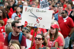 Kentucky public school teachers rally for a "day of action" at the Kentucky State Capitol to try to pressure legislators to override Kentucky Governor Matt Bevin's recent veto of the state's tax and budget bills April 13, 2018, in Frankfort, Kentucky. (Credit: Bill Pugliano/Getty Images)
