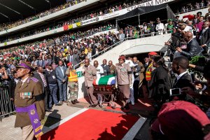 South African military personnel bring in the coffin of Winnie Madikizela-Mandela at Orlando Stadium for the funeral ceremony in Soweto, South Africa on April 14, 2018. (Credit: GIANLUIGI GUERCIA/AFP/Getty Images)