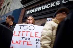 Protestor Soren Mcclay, 14, demonstrates outside a Center City Starbucks on April 15, 2018 in Philadelphia, Pennsylvania. Police arrested two black men who were waiting inside, which prompted an apology from the company's CEO. (Credit: Mark Makela/Getty Images)