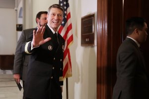 Physician to the President U.S. Navy Rear Admiral Ronny Jackson waves to journalists as he heads into a meeting with Senate Veterans Affairs Committee Chairman Johnny Isakson (R-GA) in the Russell Senate Office Building on Capitol Hill April 16, 2018, in Washington, D.C. (Credit: Chip Somodevilla/Getty Images)