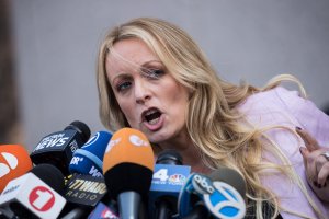 Adult film actress Stormy Daniels, whose real name is Stephanie Clifford, speaks to reporters as she exits the United States District Court Southern District of New York for a hearing related to Michael Cohen, President Trump's longtime personal attorney and confidante, April 16, 2018, in New York City. (Credit: Drew Angerer/Getty Images)
