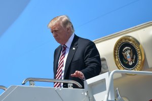 Donald Trump steps off Air Force One upon arrival at Palm Beach International in West Palm Beach, Florida on April 18, 2018. (Credit: by Mandel Ngan/AFP/Getty Images)