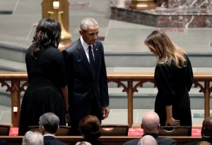 Former President Barack Obama and former first lady Michelle Obama greet first lady Melania Trump at St. Martin's Episcopal Church for a funeral service for former first lady Barbara Bush on April 21, 2018 in Houston, Texas. (Credit: David J. Phillip-Pool/Getty Images)