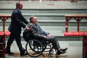 Former president George W. Bush wheels his father, former president George H.W. Bush into the church for the funeral for former first lady Barbara Bush at St. Martin's Episcopal Church on April 21, 2018 in Houston, Texas. (Credit: Brett Coomer - Pool/Getty Images)