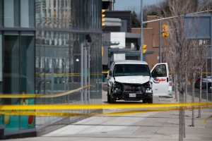 Police inspect a van suspected of mowing down pedestrians in Toronto, Ontario, Canada, on April 23, 2018. (Credit: Cole Burston/Getty Images)