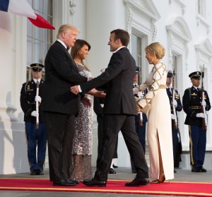 President Donald Trump and first lady Melania Trump greet French President Emmanuel Macron and French first lady Brigitte Macron before a State Dinner at the White House, April 24, 2018. (Credit: Chris Kleponis / Getty Images)