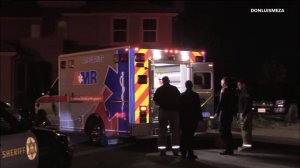 Paramedics treat a man who was injured during a home invasion in Palmdale on April 29, 2018. (Credit: DonLuisMeza)