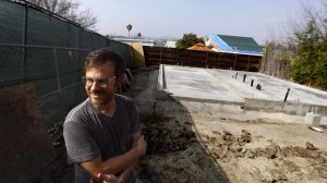 Trent Wolbe in his Highland Park backyard, where a city-sponsored second home is under construction. (Credit: Genaro Molina / Los Angeles Times)