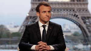 French President Emmanuel Macron poses on the TV set before an interview with RMC-BFM and Mediapart French journalists at the Theatre national de Chaillot in Paris, on April 15, 2018, after the United States, Britain and France decided to launch air strikes in Syria in response to a suspected chemical weapons attack. (Credit: FRANCOIS GUILLOT/AFP/Getty Images)