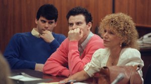 Erik Menendez, center, and Lyle Menendez are seen in during their trial in this file photo from August 1991. (Credit: Mike Nelson / Associated Press)