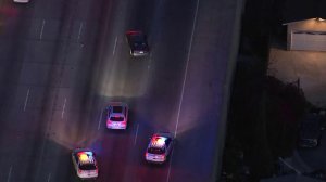 Authorities chase a Toyota Camry on the southbound 405 Freeway in the West L.A. area on April 12, 2018. (Credit: KTLA)