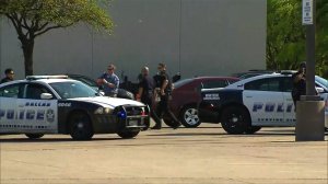 Dallas police respond to the scene where a man shot two police officers and a loss prevention officer at a Home Depot on April 24, 2018. (Credit: KTVT via CNN)