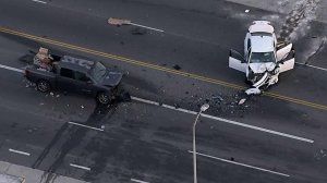 Two smashed cars are seen at the site of a crash that left four people in critical condition in Watts on April 13, 2018. (Credit: KTLA)