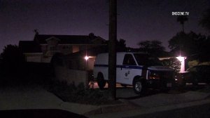 A Los Angeles County coroner's van sits outside a home where two women were found dead on April 23, 2018. (Credit: OnScene.TV)
