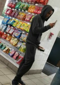 In this video still, a young man or possibly teen is seen just within moment of him beating a man inside a 7-Eleven convenience store in downtown Los Angeles on May 1, 2018. (Credit: Myra Olvera)
