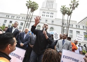 At a rally convened by L.A. City Council President Herb Wesson, homeless advocate Mel Tillekeratne speaks in support of temporary housing for the homeless in Los Angeles on May 18, 2018. (Credit: Brian van der Brug / Los Angeles Times)