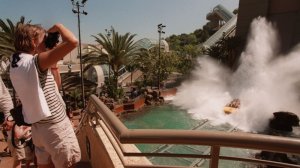 Visitors to Universal Studios Hollywood watch as riders of Jurassic Park -- The Ride splash down the final descent. A study found that the most expensive theme park to visit in the country is Universal Studios Hollywood. (Credit: Richard Derk / Los Angeles Times)