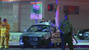 A car appears smashed following a crash in Compton with two other vehicles that left one person dead and two others injured on May 19, 2018. (Credit: LoudLabs News)
