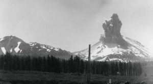 When Lassen Peak exploded on May 22, 1915, it sent a pyroclastic flow flying down the northeast flank of the volcano, creating a zone now known as the Devastated Area. The flow knocked trees down and destroyed everything in its path — 3 square miles of wilderness was obliterated. In this file photo, ash and smoke spew from Mt. Lassen. (Credit: National Park Service)