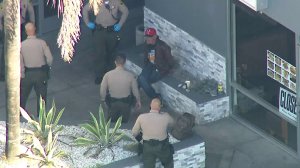 Police question a person of interest in Harbor City on May 4, 2018. (Credit: KTLA)