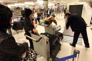 International air travelers have their baggage x-rayed as they are processed by US Customs and Border Protection agents upon arrival to Bradley International Terminal at Los Angeles International Airport on December 10, 2009, in Los Angeles, California. (Credit: David McNew/Getty Images)