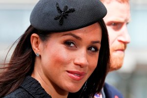 Meghan Markle arrives with her fiance Prince Harry to attend a service of commemoration on Anzac Day in Westminster Abbey in London on April 25, 2018. (Credit: Adrian Dennis / AFP / Getty Images)