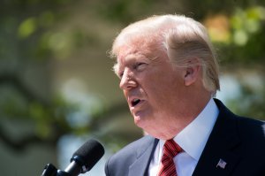 Donald Trump speaks during the presentation of the Commander-in-Chief's Trophy to the U.S. Military Academy football team in the Rose Garden of the White House on May 1, 2018. (Credit: Saul Loeb/ AFP)