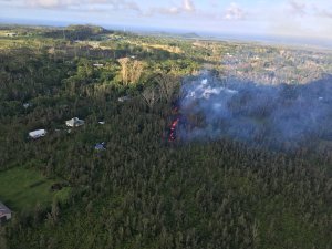 In this handout photo provided by the U.S. Geological Survey, a fissure produces lava after the eruption of Hawaii's Kilauea volcano on May 3, 2018, in the Leilani Estates subdivision near Pahoa, Hawaii. (Credit: U.S. Geological Survey via Getty Images)