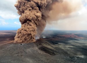 In this handout photo provided by the U.S. Geological Survey, a column of robust, reddish-brown ash plume occurred after a magnitude 6.9 South Flank following the eruption of Hawaii's Kilauea volcano on May 4, 2018, in the Leilani Estates subdivision near Pahoa.