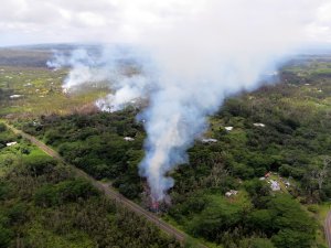 In this handout photo provided by the U.S. Geological Survey, a fissure produces lava after the eruption of Hawaii's Kilauea volcano on May 4, 2018, in the Leilani Estates subdivision near Pahoa.