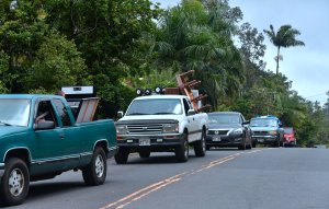 Vehicles loaded with belongings make their way back out after evacuees returned to their Leilani Estates homes to gather belongings near the town of Pahoa on Hawaii's Big Island on May 7, 2018. (Credit: Frederic J. Brown / AFP / Getty Images)