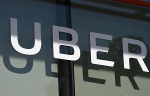 The Uber logo is seen at the second annual Uber Elevate Summit, on May 8, 2018, at the Skirball Center in Los Angeles, California. (Credit: Robyn Beck /AFP/Getty Images)