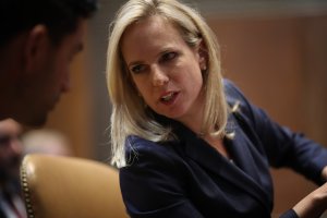 Homeland Security Secretary Kirstjen Nielsen confers with an aide while testifying before the Senate Appropriations Committee May 8, 2018. (Credit: Win McNamee / Getty Images)
