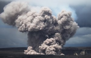 An ash plume rises from the Halemaumau crater within the Kilauea volcano summit caldera at the Hawaii Volcanoes National Park on May 9, 2018. (Credit: Mario Tama / Getty Images)