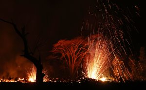 Lava is blurred as it erupts from a Kilauea volcano fissure on Hawaii's Big Island on May 17, 2018. (Credit: Mario Tama/Getty Images)