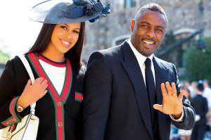 British actor Idris Elba arrives with Sabrina Dhowre for the wedding ceremony of Britain's Prince Harry, Duke of Sussex and US actress Meghan Markle at St George's Chapel, Windsor Castle, in Windsor, on May 19, 2018. (Credit: GARETH FULLER/AFP/Getty Images)