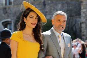 George and Amal Clooney arrive for the wedding ceremony of Britain's Prince Harry, Duke of Sussex and US actress Meghan Markle at St George's Chapel, Windsor Castle, in Windsor, on May 19, 2018. (Credit: ODD ANDERSEN/AFP/Getty Images)
