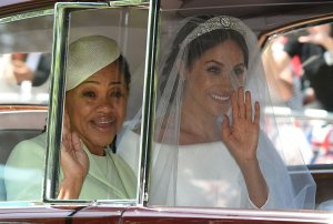 Meghan Markle and her mother, Doria Ragland, arrive for her wedding ceremony to marry Britain's Prince Harry, Duke of Sussex, at St George's Chapel, Windsor Castle, in Windsor, on May 19, 2018. (Credit: OLI SCARFF/AFP/Getty Images)