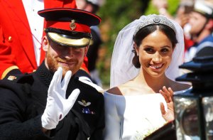 Meghan, Duchess of Sussex begins her carriage procession with Britain's Prince Harry, Duke of Sussex in the Ascot Landau Carriage after their wedding ceremony at St George's Chapel, Windsor Castle, in Windsor, on May 19, 2018. (Credit: CHRIS JACKSON/AFP/Getty Images)