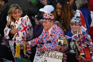 Royal fans enjoy the atmosphere prior to the wedding of Prince Harry to Ms. Meghan Markle at St George's Chapel, Windsor Castle on May 19, 2018 in Windsor, England. (Credit: Leon Neal/Getty Images)
