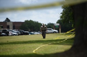 Police officers patrol outside Santa Fe High School on May 19, 2018, in Santa Fe, Texas. (Credit: BRENDAN SMIALOWSKI/AFP/Getty Images)